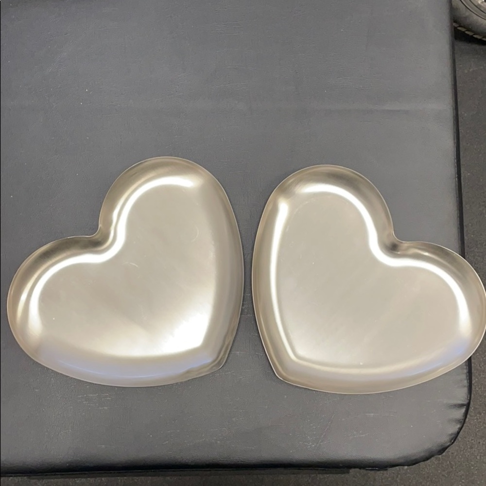 Two heart shape silver color bowls